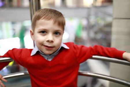 Portrait of smiling child in an elevatorの写真素材