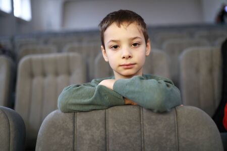 Boy watching a performance in a theaterの写真素材