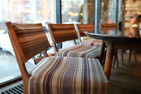 Interior view of empty restaurant in the eveningの写真素材