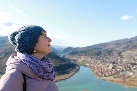 Tourist on background of Mtskheta in winter, Georgia