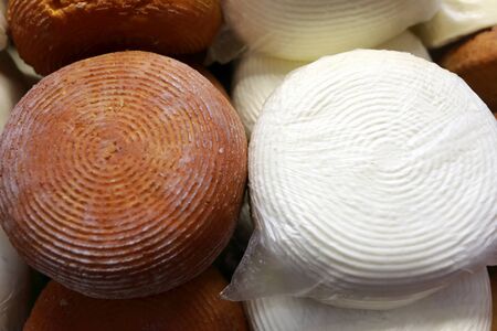 Cheese heads on counter in the market