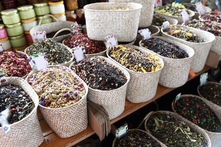 View of various herbal teas in baskets in marketの写真素材