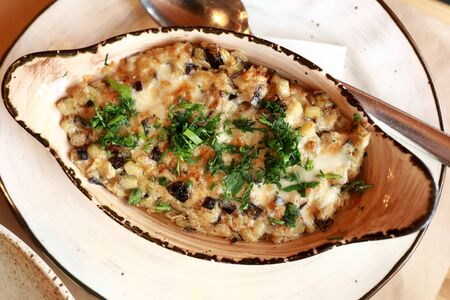 Plate with julienne on table in restaurantの写真素材