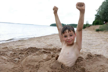Child on beach of Lake Seliger, Ostashkov, Russiaの写真素材