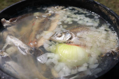 Bowl with fresh river fish on tableの写真素材