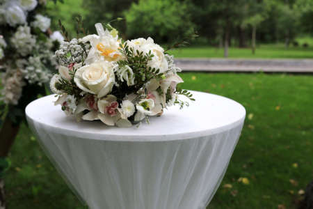 Part of wooden frame with flowers in parkの写真素材
