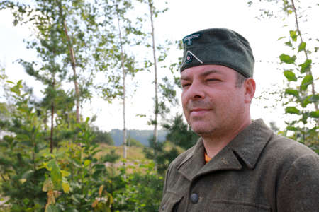 Portrait of man in uniform of Wehrmacht soldier in park