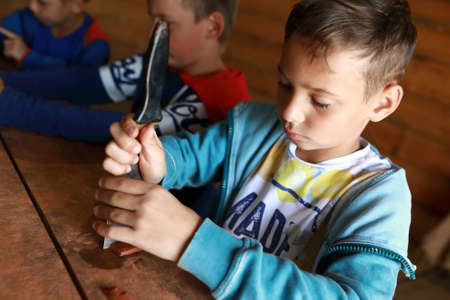 Kids making mascot with runes in workshopの写真素材