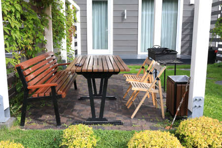 View of barbecue area in backyard in summer