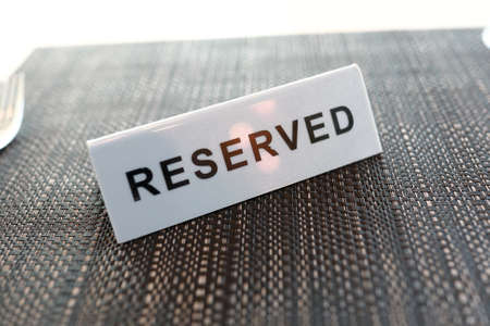 Reserved sign on table in a restaurantの素材 [FY310156888774]