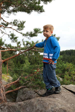 Kid posing On Mount Paaso in summer, Kareliaの写真素材