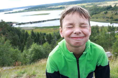 Happy Boy On Mount Paaso in summer, Kareliaの写真素材