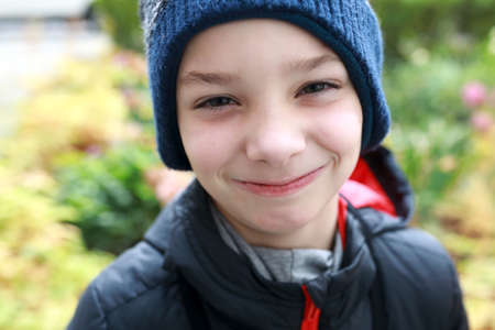 Portrait of boy in autumn park, Russia