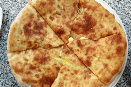 Plate with Megrelian Khachapuri in georgian restaurant