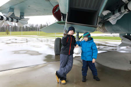 Children on background of Russian multipurpose supersonic fighter of the fourth generation Flanker-Bの写真素材