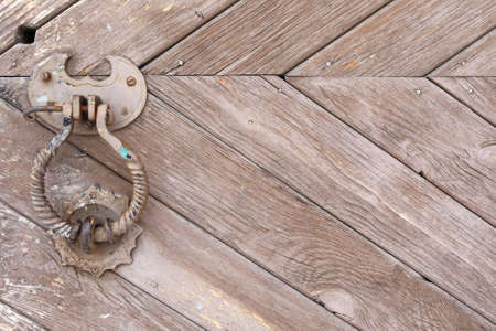 Part of brown wooden door of building