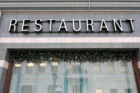Restaurant signboard on wall building in Kazan