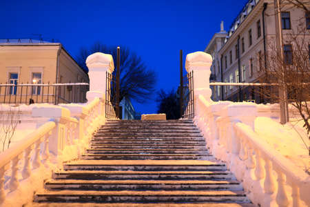 Gate of park black lake in Kazan in winter at nightの写真素材