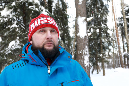 Portrait of man in winter park, Russia