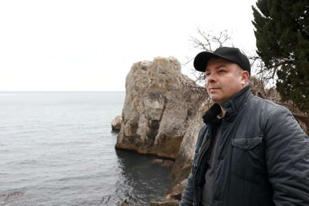 Man on background of Chekhov Bay in spring, Gurzuf, Crimeaの写真素材