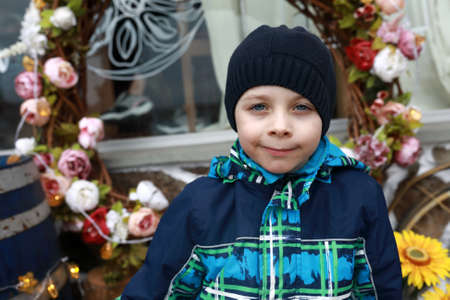 Child on background of decoration of flowers, Gurzuf, Crimea