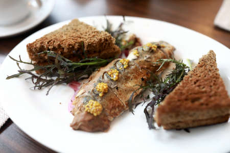 Smoked mackerel with toasted bread in restaurant