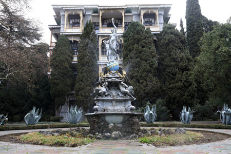View of old Fountain Goddess Night in Gurzuf Park in spring