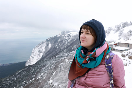 Woman posing on observation deck of Ai-Petri mountain peak in springの写真素材