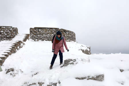 Woman comes off observation deck of Ai-Petri mountain peak in springの写真素材