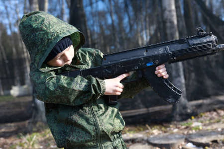 Child playing laser tag in the park
