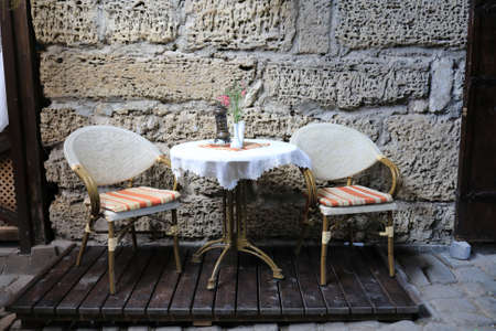 Table and two chairs of cafe on street, Yevpatoria, Crimeaの写真素材