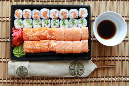 Sushi set on wooden mat in restaurant