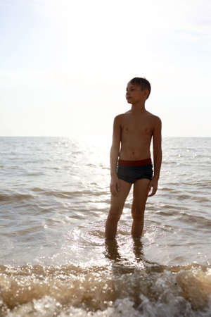 Portrait of child on beach of Azov sea in summerの写真素材