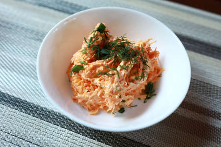 Carrot salad with cheese and garlic in restaurantの写真素材