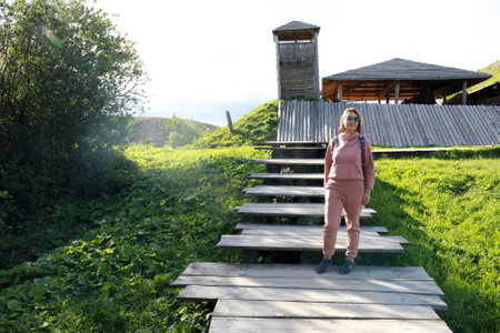 Woman posing on viking fortress background, Karelia