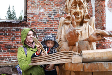 Mother and Son write down Desires at Lutheran Church, Karelia, Lahdenpohjaの写真素材