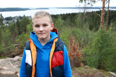 Boy on Mount Hiidenvuori in summer, Kareliaの写真素材