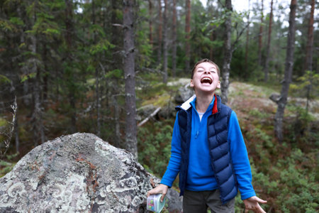 Child found treasure in forest playing quest, Kareliaの写真素材