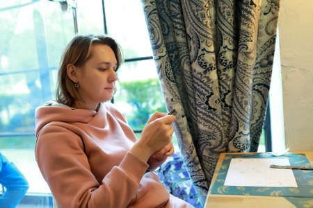 Portrait of woman with smartphone in restaurant