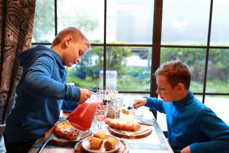 Portrait of children have lunch in restaurantの写真素材