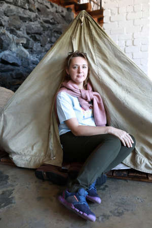 Portrait of woman posing with vintage tentの写真素材