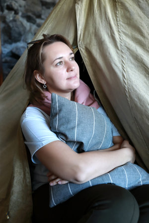 Portrait of woman posing in retro tentの写真素材