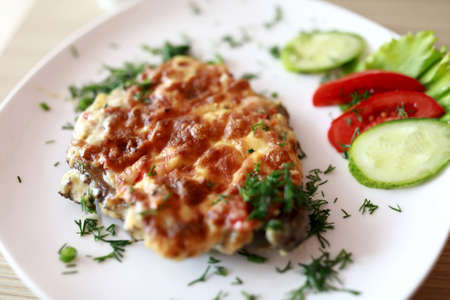 French meat with vegetables on plate in restaurantの写真素材