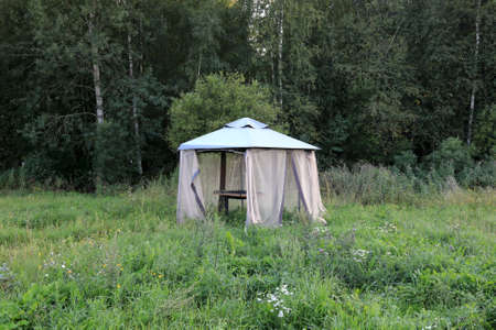 Summer gazebo made of fabric mesh, Kareliaの写真素材