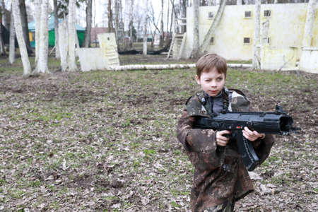 Portrait of kid playing laser tag in parkの写真素材