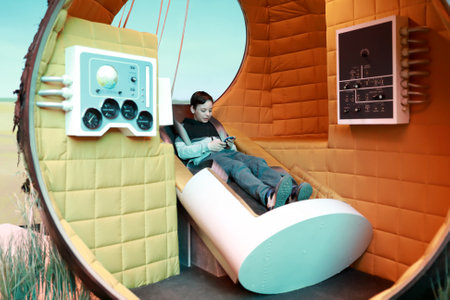 Moscow, Russia. May 2, 2022. Editorial Use Only. Boy sitting in space descent vehicle at VDNKh.のeditorial素材