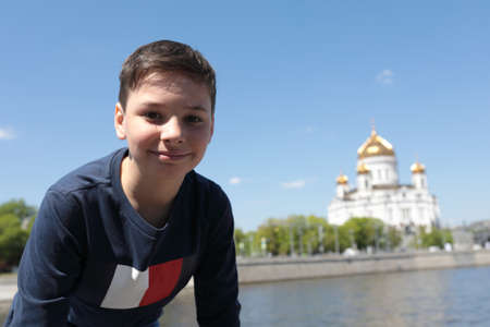 Portrait of child in front of Cathedral of Christ the Savior in Moscowの写真素材