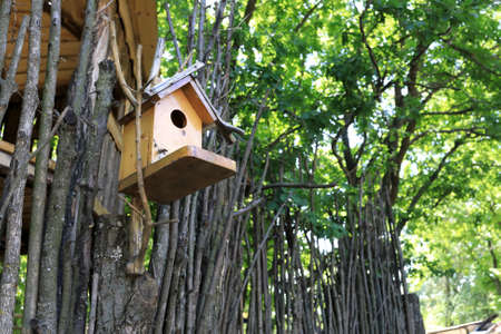 Details of nesting box on fence in parkの写真素材