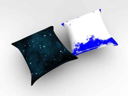 Two pillows which are put on pillowcases representing day and nightの写真素材