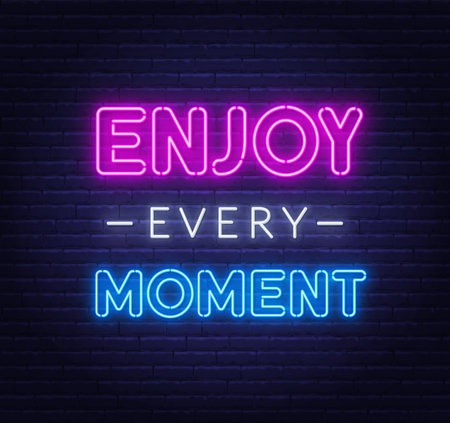 Enjoy every moment neon inspirational quote on a brick wall.のイラスト素材